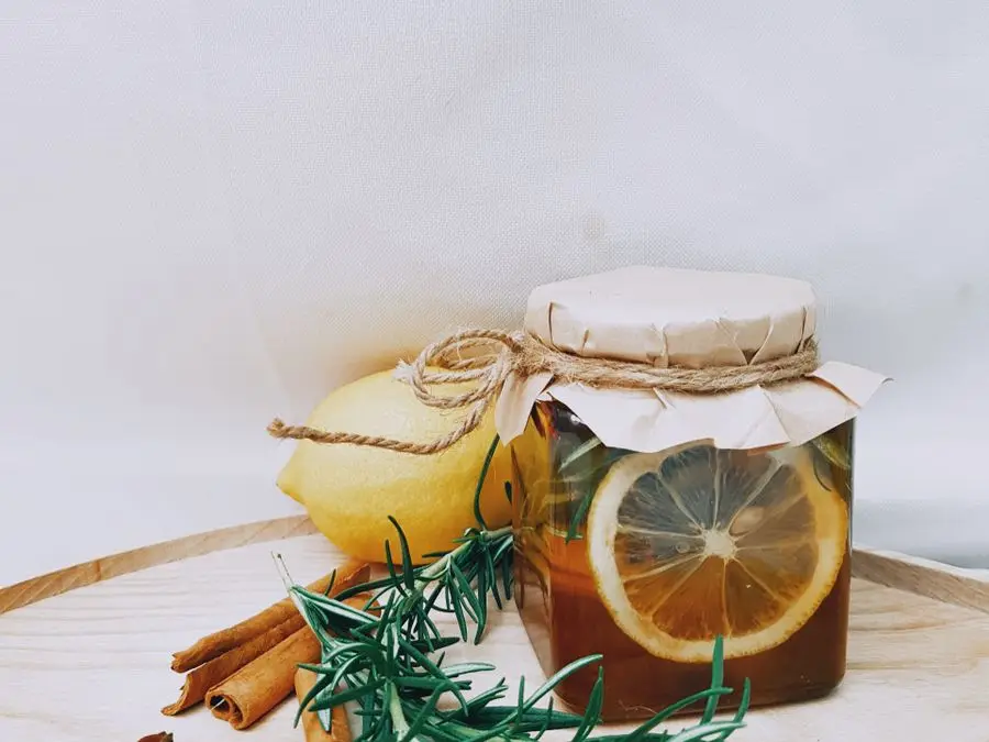 A jar of heart wellness infusion with lemon, cinnamon, star anise, and rosemary
