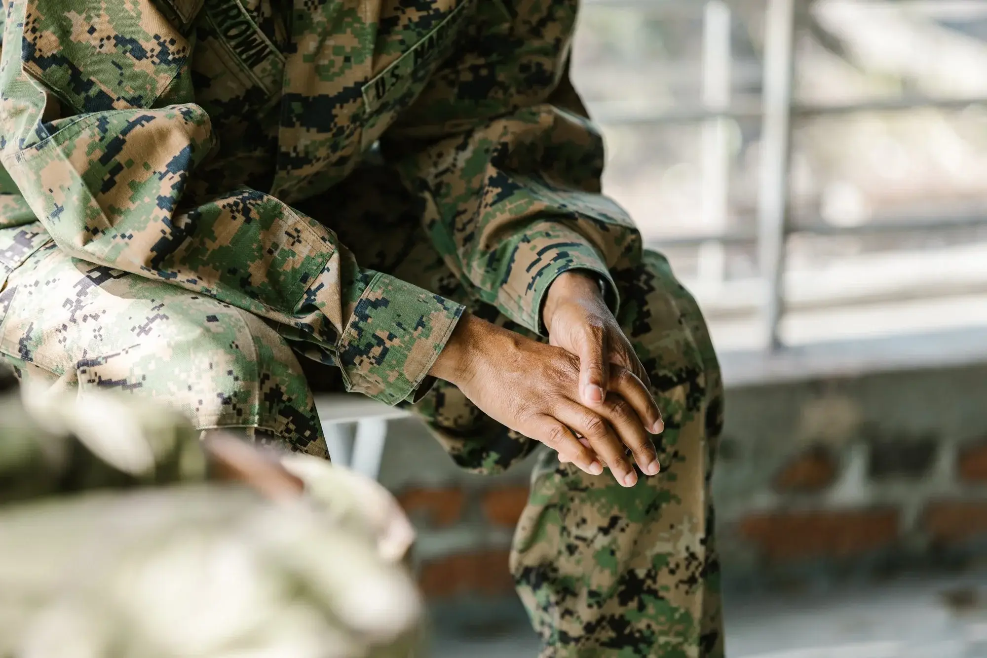 A Veteran in silhouette, reflecting on the mental health challenges faced after service
