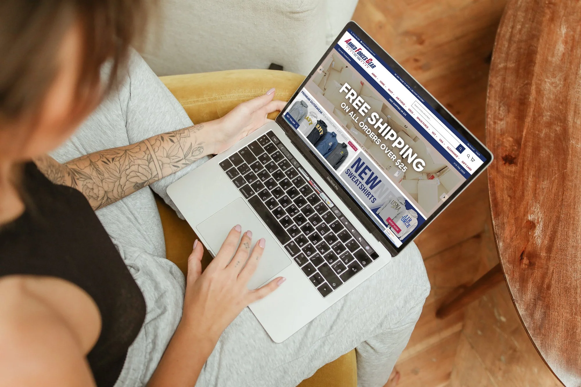 Person shopping the Armed Forces Gear store on a laptop