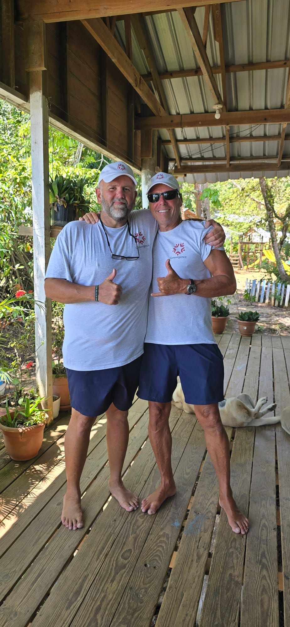 Two Convergence Veterans in Convergence t-shirts on the retreat porch